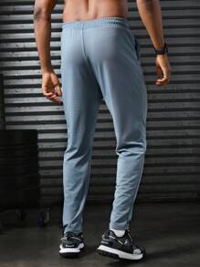 Manfinity Sport Corelite Men's Letter Printed Drawstring Waist Pocket Sports Pants Workout Clothes Running Pants