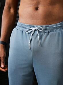 Manfinity Sport Corelite Men's Letter Printed Drawstring Waist Pocket Sports Pants Workout Clothes Running Pants