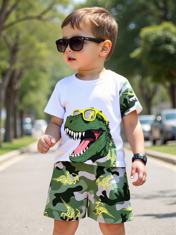 GraphicGems 1 Set de ropa de estilo genial para niños pequeños: Camiseta con gafas de sol y estampado de dinosaurios, pantalones cortos con estampado de esqueleto de dinosaurio camuflado. Uso casual diario y escolar, apropiado para primavera/verano