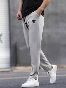 Manfinity Homme Pantalones de chándal casuales para hombre con cintura con cordón y bolsillos, estampado geométrico