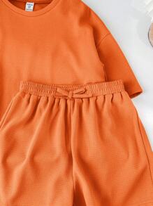 SHEIN LMoss Kids طقم تي شيرت وشورت ذو ياقة دائرية بأكمام قصيرة ولون كتان مصنوع من نسيج مطرز لفتيات ما بين الطفولة والمراهقة، مناسب لمهرجان الموسيقى - لون برتقالي - مشاهدة 6
