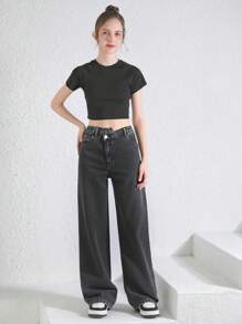 Pantalones informales de niña adolescente con pierna recta y estampado de copos de nieve en negro