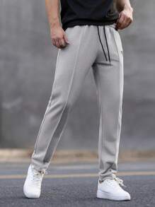Manfinity Homme Pantalones de chándal casuales para hombre con cintura con cordón y bolsillos, estampado geométrico