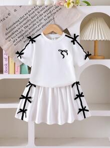 Bộ 2 món/bộ cho bé gái áo thun in nơ cổ tròn dễ thương màu đen thoải mái và váy ngắn cạp chun - trắng - Xem 4