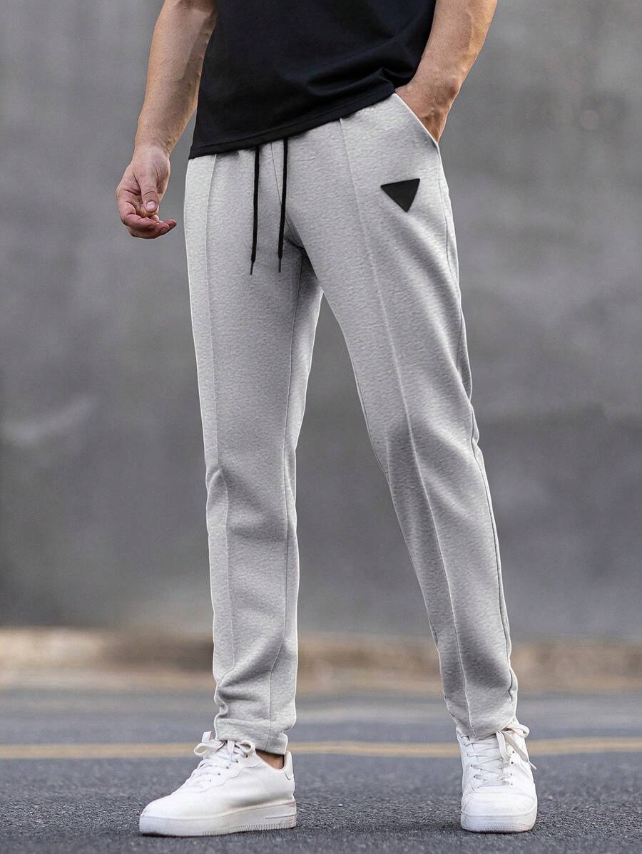 Manfinity Homme Pantalones de chándal casuales para hombre con cintura con cordón y bolsillos, estampado geométrico