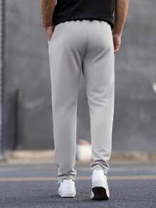 Manfinity Homme Pantalones de chándal casuales para hombre con cintura con cordón y bolsillos, estampado geométrico
