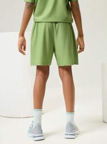 SHEIN Abbigliamento per il ritorno a scuola, pantaloncini sportivi professionali per ragazze e ragazzi pre-adolescenti, pantaloncini sportivi professionali per bambini con vita elastica, cucitura a 4 aghi e 6 fili senza cuciture, con stampa divertente a lettere