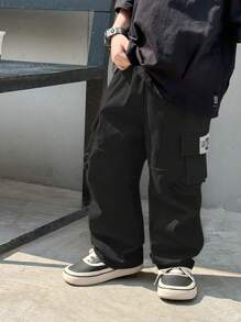 SHEIN 1pc Young Boy Casual Hip Cool Hip Hop Style Loose Windbreaker Material Large Patch Pockets Woven Mark Design Street Retro College Style Wide Leg Pants - Black - View 6