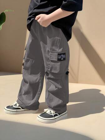 SHEIN Pantalones cargo casuales y versátiles de unicolor para niños