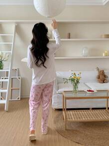 少女纯色前扣领蕾丝口袋碎花优雅休闲睡衣套装，配有长袖上衣和裤子