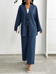 SHEIN Lady Conjunto de 2 piezas de talla grande para mujer, top de manga larga con nudo delantero y pantalones, de color azul denim sólido. Conjunto de 2 piezas de talla grande para mujer, conjunto de playa casual para mujer de negocios