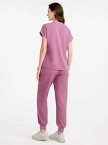 Scrubzie Conjunto de uniforme de ropa médica con top de cuello redondo de color liso con bolsillo y pantalones