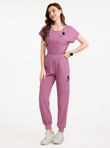 Scrubzie Conjunto de uniforme de ropa médica con top de cuello redondo de color liso con bolsillo y pantalones