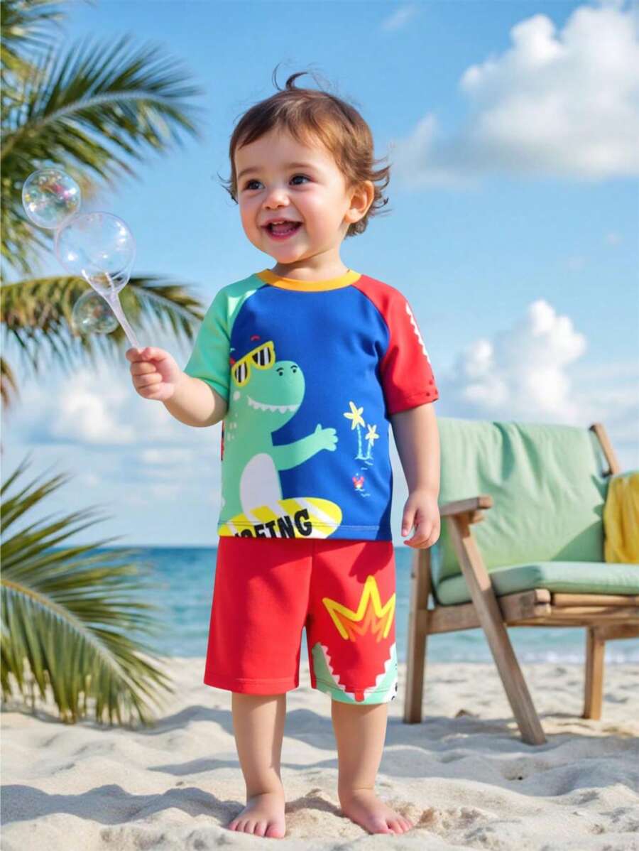 SHEIN 2pcs Baby Boy Cartoon Dinosaur Pattern Round Neck Raglan Sleeve Top And Elastic Waist Shorts Swimsuit Set - Multicolor - View 1