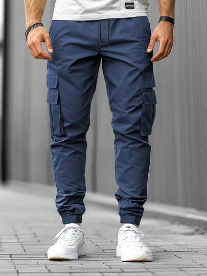 Manfinity Homme Męskie spodnie casualowe w jednolitym kolorze ze ściągaczem w pasie i kieszeniami cargo, jesień