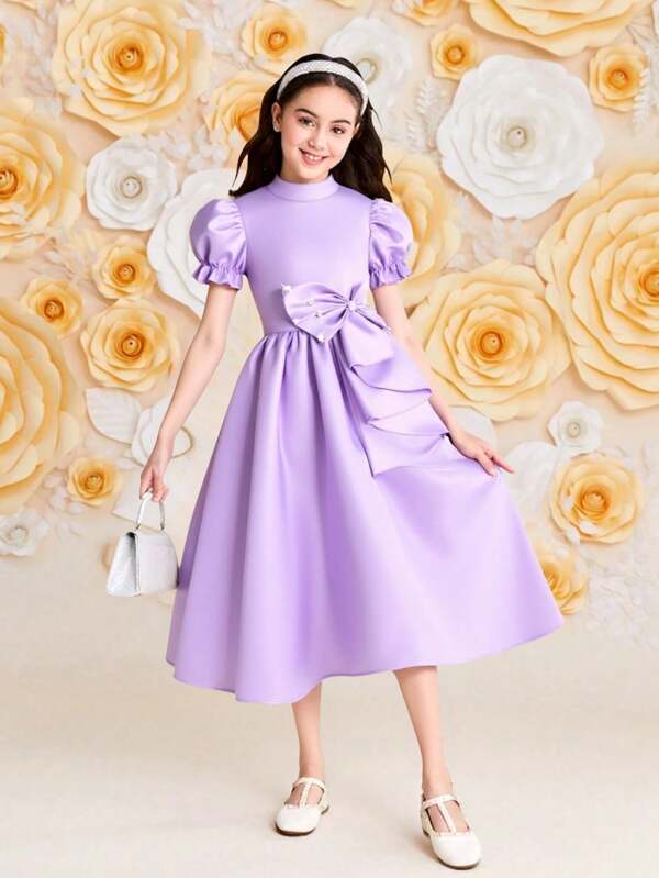 Robe pour préadolescente, robe rose avec nœud et décoration volantée sur la taille avant, nœud papillon travaillé avec des détails perlés, manches bouffantes, style élégant pour l'été