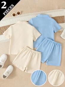 SHEIN مجموعة من 2 قطعة بلوزة مُحاكة وشورت للأطفال الصغار، باللون الأزرق والأبيض، مناسب للارتداء اليومي أو الحفلات والمناسبات لإبراز شخصية وأناقة الطفل