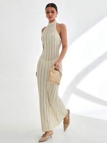 CLARA VERO Vestido largo de punto acanalado sin mangas con cuello alto y detalle de espalda abierta en color blanco