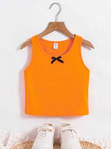 SHEIN Parte superior de tirantes con lazo frontal en estilo casual de calle para niñas preadolescentes