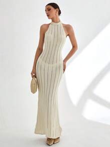 CLARA VERO Vestido largo de punto acanalado sin mangas con cuello alto y detalle de espalda abierta en color blanco
