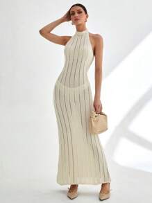 CLARA VERO Vestido largo de punto acanalado sin mangas con cuello alto y detalle de espalda abierta en color blanco