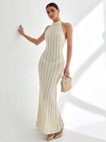 CLARA VERO Vestido largo de punto acanalado sin mangas con cuello alto y detalle de espalda abierta en color blanco