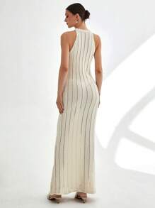 CLARA VERO Vestido largo de punto acanalado sin mangas con cuello alto y detalle de espalda abierta en color blanco