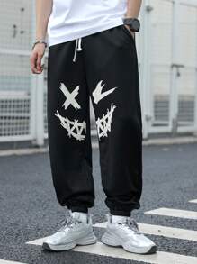 SHEIN Pantaloni de trening negri imprimați cu model de desene animate pentru adolescenți, colegii casual, comozi și la modă, versatil, țesătură moale, potriviti pentru uzura zilnică, școală, călătorii, sporturi în aer liber, primăvară/vară