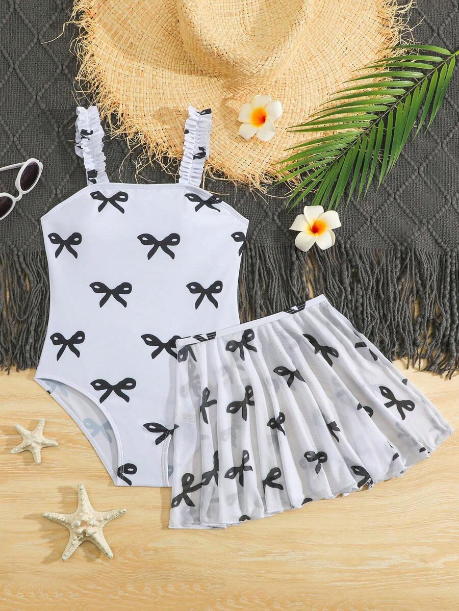 SHEIN Traje de baño de una pieza con camiseta de tirantes y estampado de lazos, con falda de malla, para niña preadolescente - Blanco y Negro - Ver 1