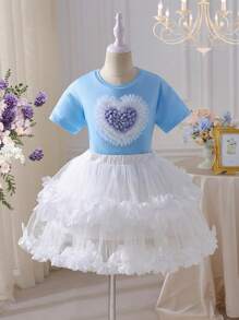 SHEIN 2 pezzi Set bambina - maglietta a maniche corte con scollo tondo e cuore 3D + gonna a ruota stile torta. Design elegante a cuore 3D, gonna a ruota stile torta, adatta per gioco all'aperto, casual a casa, attività scolastiche, feste di compleanno e altre occasioni, permettendo alla tua piccola principessa di godersi l'estate gioiosa! - Multicolore - Visualizzare 8
