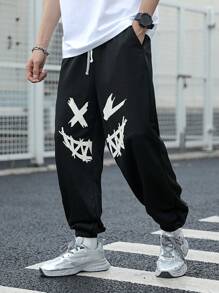 SHEIN Pantaloni de trening negri imprimați cu model de desene animate pentru adolescenți, colegii casual, comozi și la modă, versatil, țesătură moale, potriviti pentru uzura zilnică, școală, călătorii, sporturi în aer liber, primăvară/vară