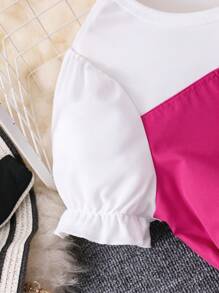 Completo per ragazze pre-adolescenti, composto da top con maniche a palloncino e cintura, e pantaloni a zampa ampia di colore unito