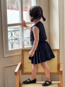 Conjunto de chaleco de un solo pecho de unicolor y falda plisada para niña bebé