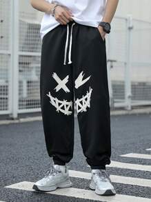 SHEIN Pantaloni de trening negri imprimați cu model de desene animate pentru adolescenți, colegii casual, comozi și la modă, versatil, țesătură moale, potriviti pentru uzura zilnică, școală, călătorii, sporturi în aer liber, primăvară/vară