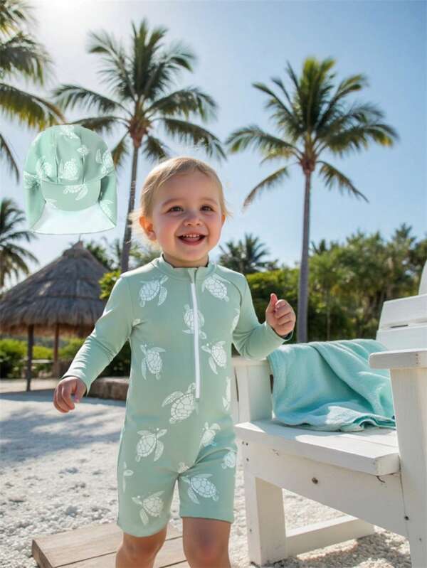 SHEIN Bañador de una pieza de manga larga para niños con gorra de natación, conjunto para playa y spa