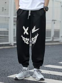 SHEIN Pantaloni de trening negri imprimați cu model de desene animate pentru adolescenți, colegii casual, comozi și la modă, versatil, țesătură moale, potriviti pentru uzura zilnică, școală, călătorii, sporturi în aer liber, primăvară/vară
