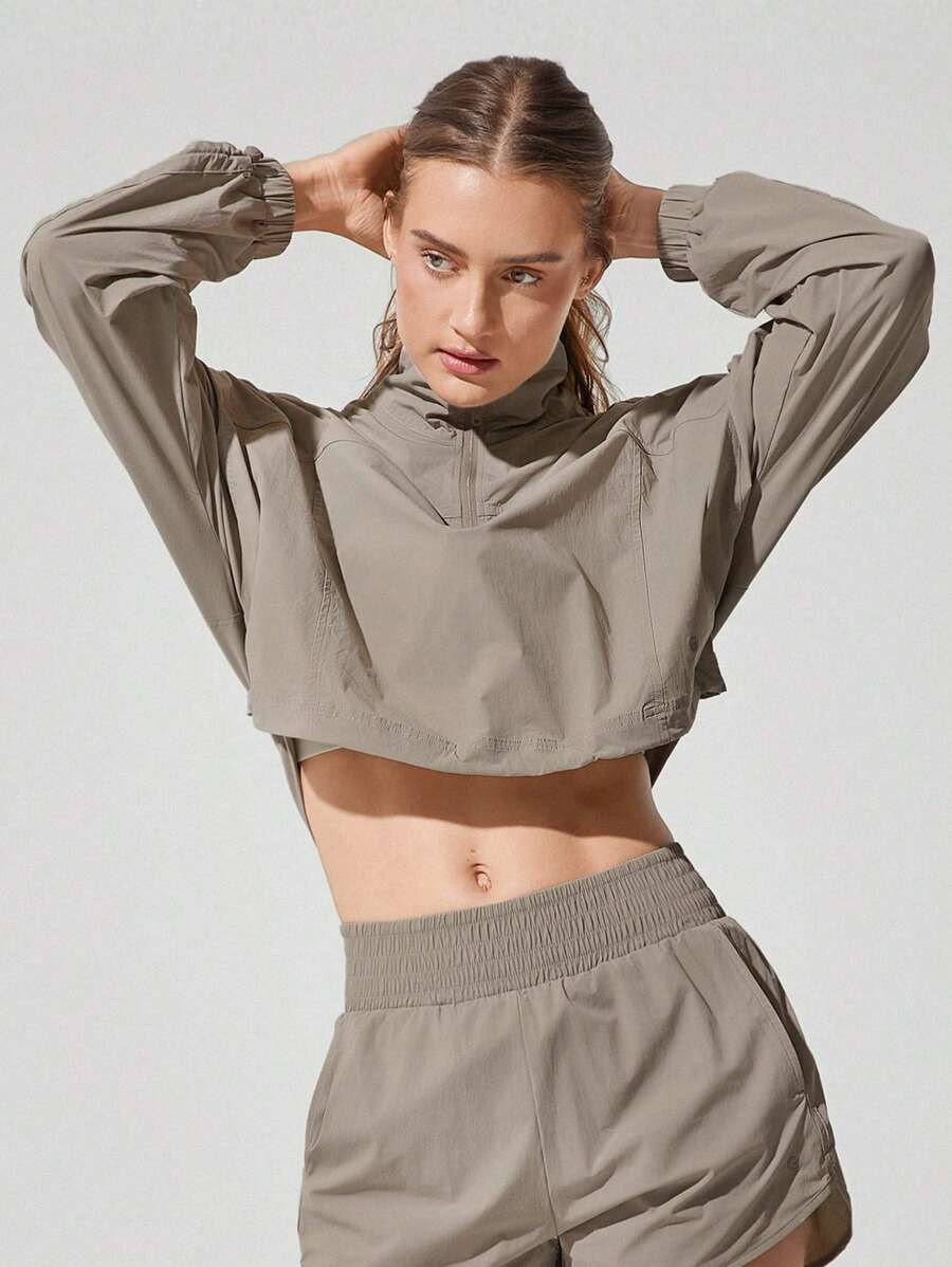 GLOWMODE 编织透气轻盈宽松可调节袖子半拉链领短款套头衫健身房运动跑步 - 卡其色 - 查看 1