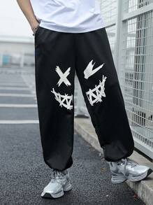 SHEIN Pantaloni de trening negri imprimați cu model de desene animate pentru adolescenți, colegii casual, comozi și la modă, versatil, țesătură moale, potriviti pentru uzura zilnică, școală, călătorii, sporturi în aer liber, primăvară/vară