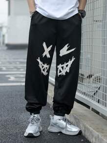 SHEIN Pantaloni de trening negri imprimați cu model de desene animate pentru adolescenți, colegii casual, comozi și la modă, versatil, țesătură moale, potriviti pentru uzura zilnică, școală, călătorii, sporturi în aer liber, primăvară/vară