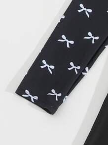 SHEIN Tween Girls Tankinis - White Bow Print & Solid Black 2pcs Set, Long Sleeve Cropped Tankini Top & Long Pants, Casual & Fashionable, Suitable For Vacation & Swimming