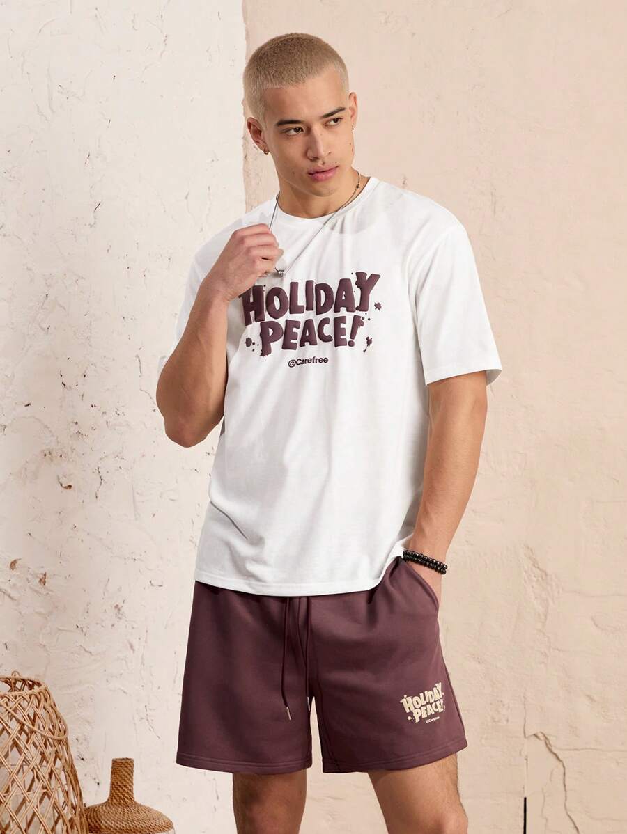 Manfinity VCAY Set de 2 piezas con camiseta de manga corta de cuello redondo de corte holgado estampada y pantalones cortos con cintura elástica para hombre