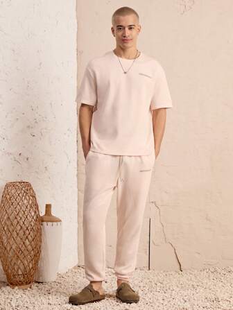 Manfinity Unisex 2 Stücke/Set Herren Rundhals Loose Fit Kurzarm T-Shirt und Hose mit Zugbund Taille Set