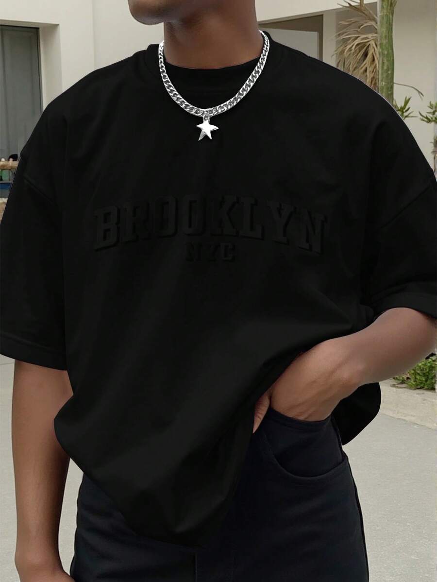 Manfinity Homme 大码男士短袖连体衣,oversize,男士休闲简约字母标语刺绣工艺T恤,宽松落肩休闲短袖T恤,浅卡其米色麂皮纹理面料T恤,年轻街头潮流,热销,送给男朋友的礼物,年轻休闲运动街头日常通勤百搭返校度假装,送给男朋友和老公的礼物首选,情侣装 - 黑色 - 查看 1