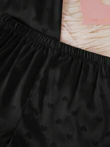 Conjunto de pijama con camiseta de manga corta y pantalones cortos con estampado de corazones de seda sintética para niñas