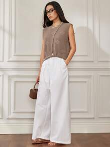 Dazy-Less Top en tricot style décontracté pour vacances, avec design crochet découpé et nœud, manches courtes et effet ajouré. Idéal pour l'été, décontracté mais chic pour une tenue casual d'affaires pour femmes.