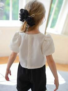 SHEIN Cardigan de cuello en V de manga abullonada y cintura alta de color albaricoque con gran moño y botones negros decorativos, blusa de manga corta de moda para niñas