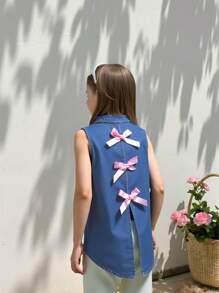 女童休闲宽松牛仔衬衫，前短后长设计，甜美可爱的蝴蝶装饰，简约时尚百搭，适合日常穿着