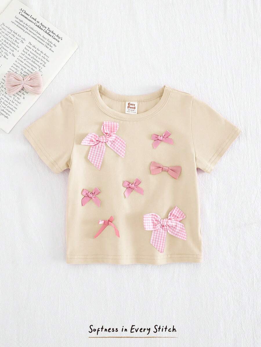 Cozy Pixies Baby Girl Textured Bow Knit Soft Round Neck Short Sleeve Pullover Top - Apricot - View 1