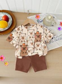SHEIN Set de 2 piezas de camiseta de manga corta holgada y shorts con estampado de capibara lindo e informal para niñas, adecuado para verano