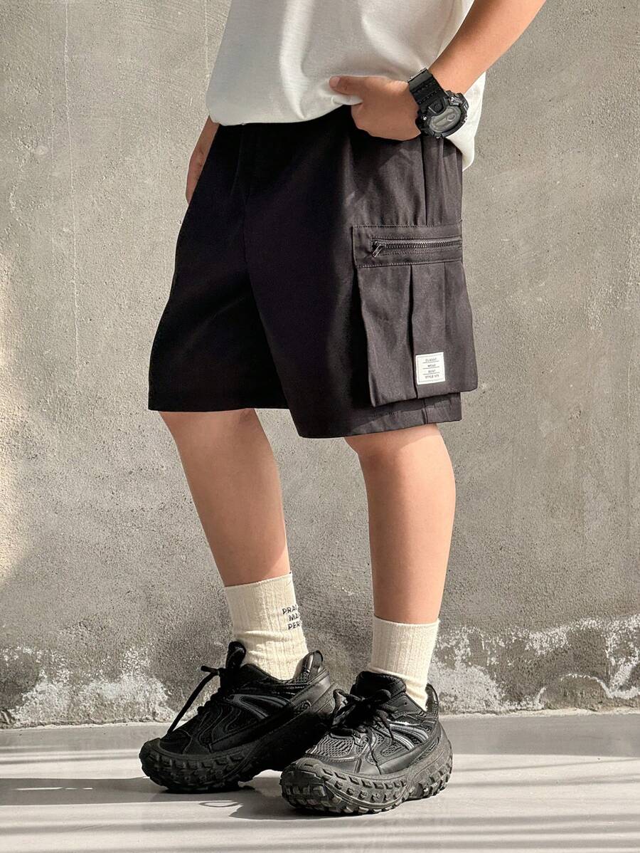 SHEIN Tween Boy's Casual Loose Woven Cargo Shorts With 3D Utility Pockets & Elastic Waist, Soft & Comfortable, Versatile For Spring/Summer, Suitable For Daily Wear, Outdoor Activities, School, Streetwear, Parties & Leisure - Black - View 1